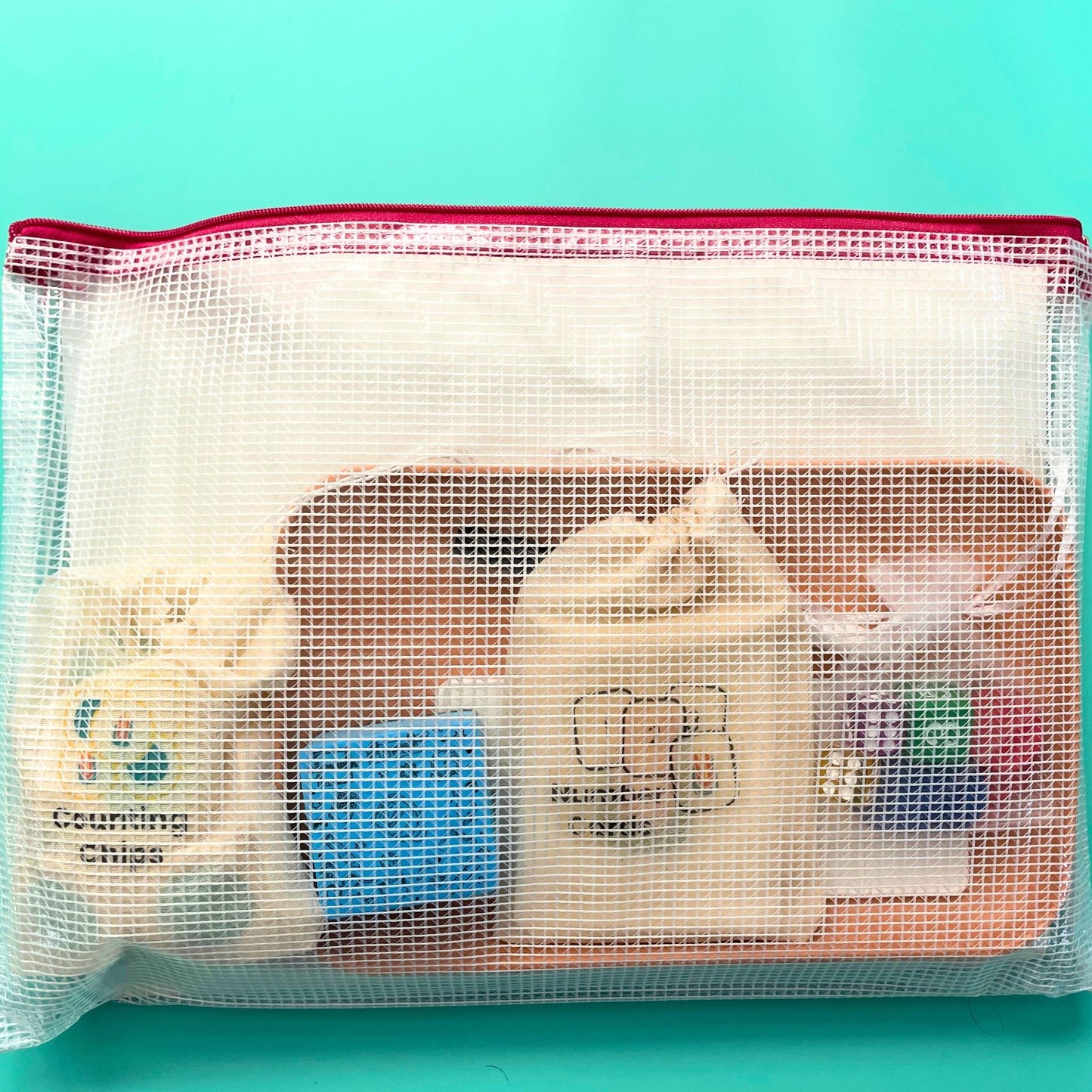 Math in Reach Starter Kit packed neatly in mesh storage pouch with counting chips, number cards, dice, and tray visible inside.